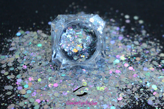 This glitter is called Ice Queen and is part of the super chunky glitter collection. It consists of holographic silver glitter with a dazzling sparkle. Ice Queen can be used for your face, body, hair and nails.  Available in 5g and 10g jars.
