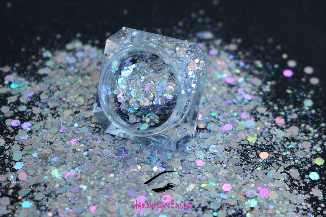This glitter is called Ice Queen and is part of the super chunky glitter collection. It consists of holographic silver glitter with a dazzling sparkle. Ice Queen can be used for your face, body, hair and nails.  Available in 5g and 10g jars.