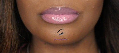 Strawberry Dream is a gorgeous pink hydrating gloss that smells just like her name. This gloss is also vegan, gluten-free, high shine, smooth and long lasting. It's made with premium rich ingredients to keep your lips soft, moisturized and luscious without feeling sticky. Strawberry Dream is available in a squeeze tube and a wand tube (doe foot applicator) for a more precise application.