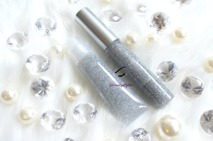 Princess Cut is a clear hydrating gloss with extra fine silver holographic glitter. This gloss is also vegan, gluten-free, high shine, smooth and long lasting. It's made with premium rich ingredients to keep your lips soft, moisturized and luscious without feeling sticky. Princess Cut is available in a squeeze tube and a wand tube (doe foot applicator) for a more precise application.