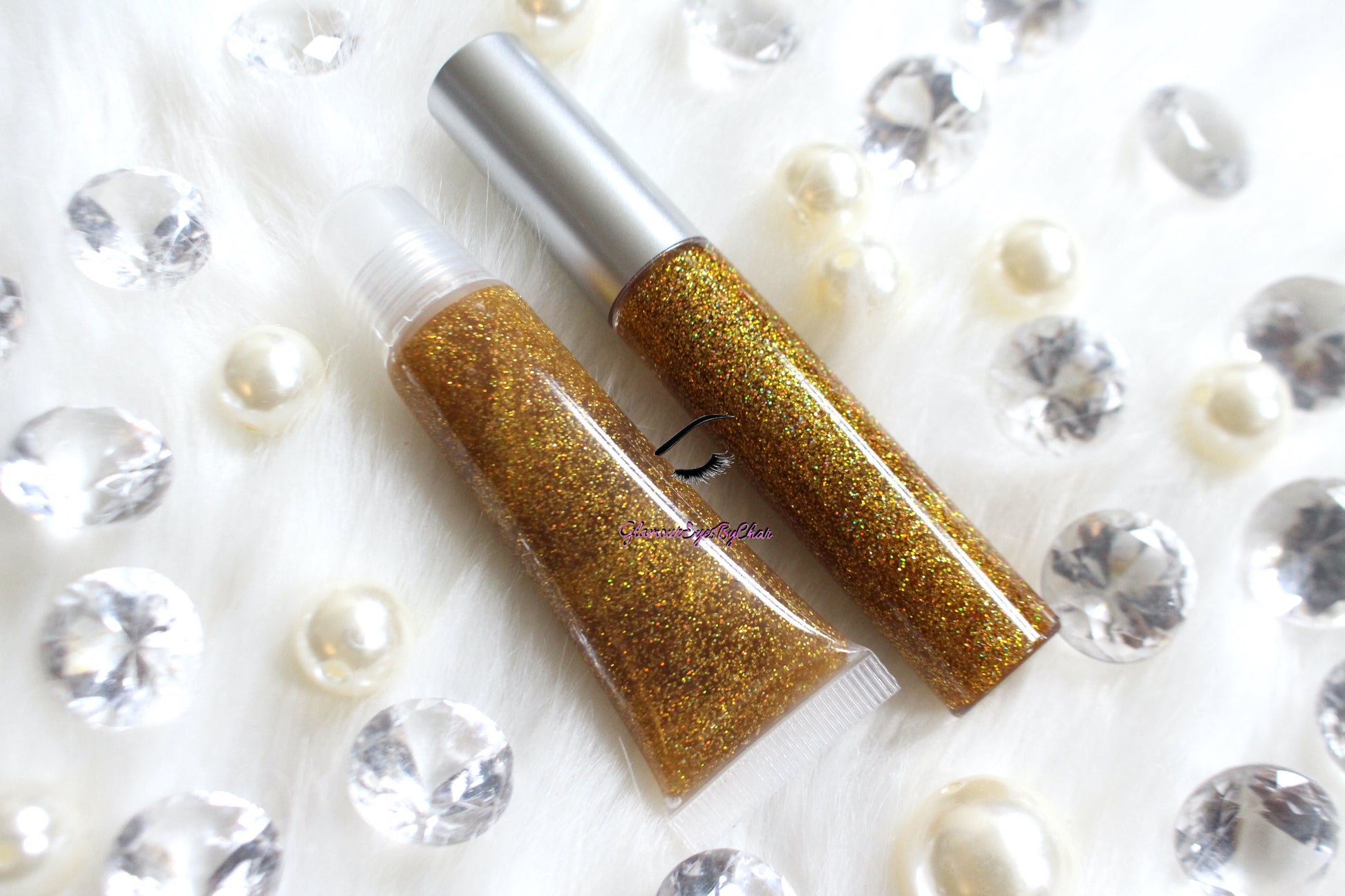 I Said Yes is a clear hydrating gloss with extra fine gold holographic glitter. This gloss is also vegan, gluten-free, high shine, smooth and long lasting. It's made with premium rich ingredients to keep your lips soft, moisturized and luscious without feeling sticky. I Said Yes is available in a squeeze tube and a wand tube (doe foot applicator) for a more precise application.