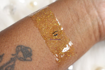 I Said Yes is a clear hydrating gloss with extra fine gold holographic glitter. This gloss is also vegan, gluten-free, high shine, smooth and long lasting. It's made with premium rich ingredients to keep your lips soft, moisturized and luscious without feeling sticky. I Said Yes is available in a squeeze tube and a wand tube (doe foot applicator) for a more precise application.