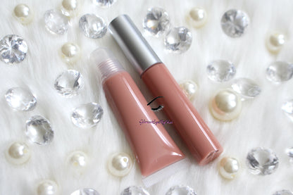 Barely There is a gorgeous nude pink with touch of brown hydrating gloss. This gloss is also vegan, gluten-free, high shine, smooth and long lasting. It's made with premium rich ingredients to keep your lips soft, moisturized and luscious without feeling sticky. Barely There is available in a squeeze tube and a wand tube (doe foot applicator) for a more precise application.