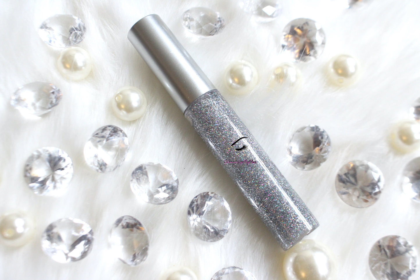 Princess Cut is a clear hydrating gloss with extra fine silver holographic glitter. This gloss is also vegan, gluten-free, high shine, smooth and long lasting. It's made with premium rich ingredients to keep your lips soft, moisturized and luscious without feeling sticky. Princess Cut is available in a squeeze tube and a wand tube (doe foot applicator) for a more precise application.