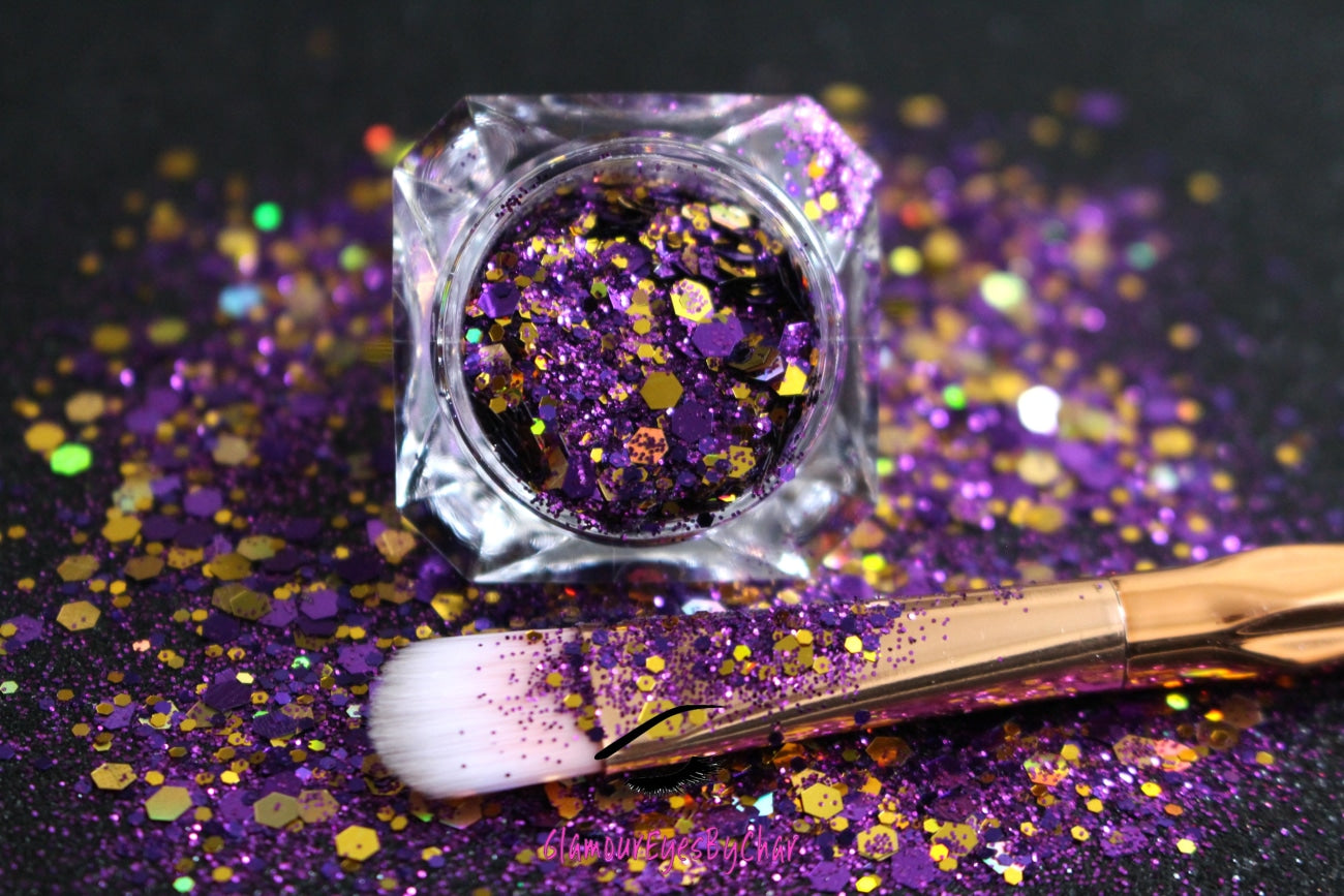 This glitter is called Lakers and is part of the super chunky glitter collection.  It consists of royal purple with golden holographic sparkles. If you're an LA Lakers fan, this is perfect for you. Lakers can be used for your face, body, hair and nails.  Comes in 5g and 10g jars.