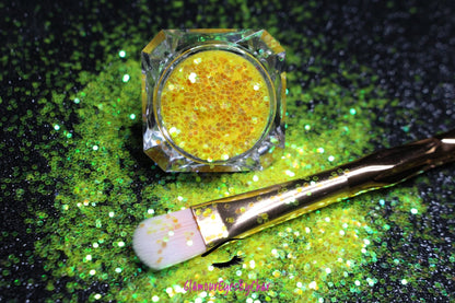 This glitter is called Lemon Drops and is part of the simple glitter collection. It consists of bright yellow glitter with an iridescent sparkle. Flake size is larger than fine and extra fine glitter. Lemon Drops can be used for your face, body, hair and nails.