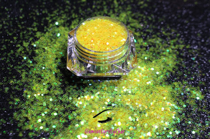 This glitter is called Lemon Drops and is part of the simple glitter collection. It consists of bright yellow glitter with an iridescent sparkle. Flake size is larger than fine and extra fine glitter. Lemon Drops can be used for your face, body, hair and nails.