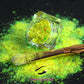 This glitter is called Lemon Lime and is part of the super chunky glitter collection. It consists of fluorescent iridescent green glitter that may look yellow depending on how the light reflects. Lemon Lime can be used for your face, hair, body and nail art, glitter slime, resin art or DIY projects.  Comes in 5g jars only.