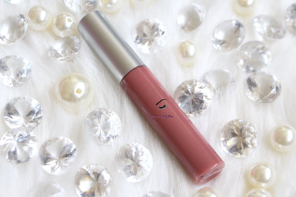 Lala is a gorgeous nude pink hydrating gloss. This gloss is also vegan, gluten-free, high shine, smooth and long lasting. It's made with premium rich ingredients to keep your lips soft, moisturized and luscious without feeling sticky. Lala is available in a squeeze tube and a wand tube (doe foot applicator) for a more precise application.