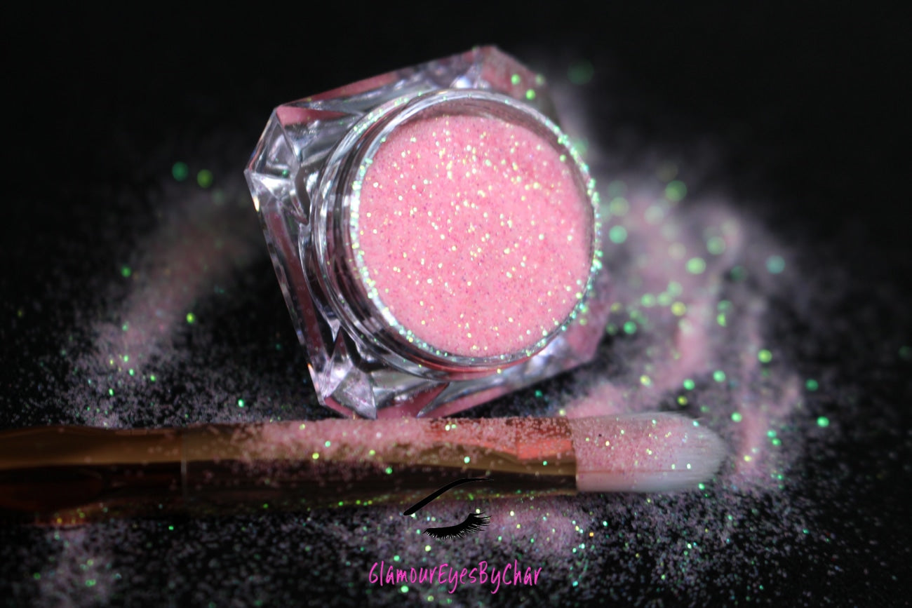 This glitter is called Pink Lemonade and is part of the simple glitter collection. It consists of soft baby pink glitter with an iridescent sparkle. Pink Lemonade can be used for your face, body, hair and nails. Comes in 5g jars only.  