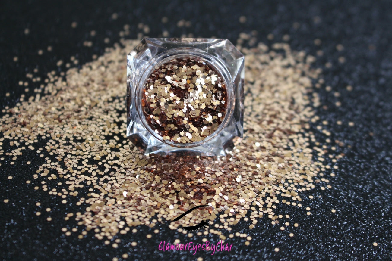 This glitter is called Pot of Gold and is part of the simple glitter collection. It consists of champagne gold glitter with a beautiful sparkle. Flake size is larger than fine and extra fine glitter. Blush can be used for your face, body, hair and nails. Comes in 5g jars only.