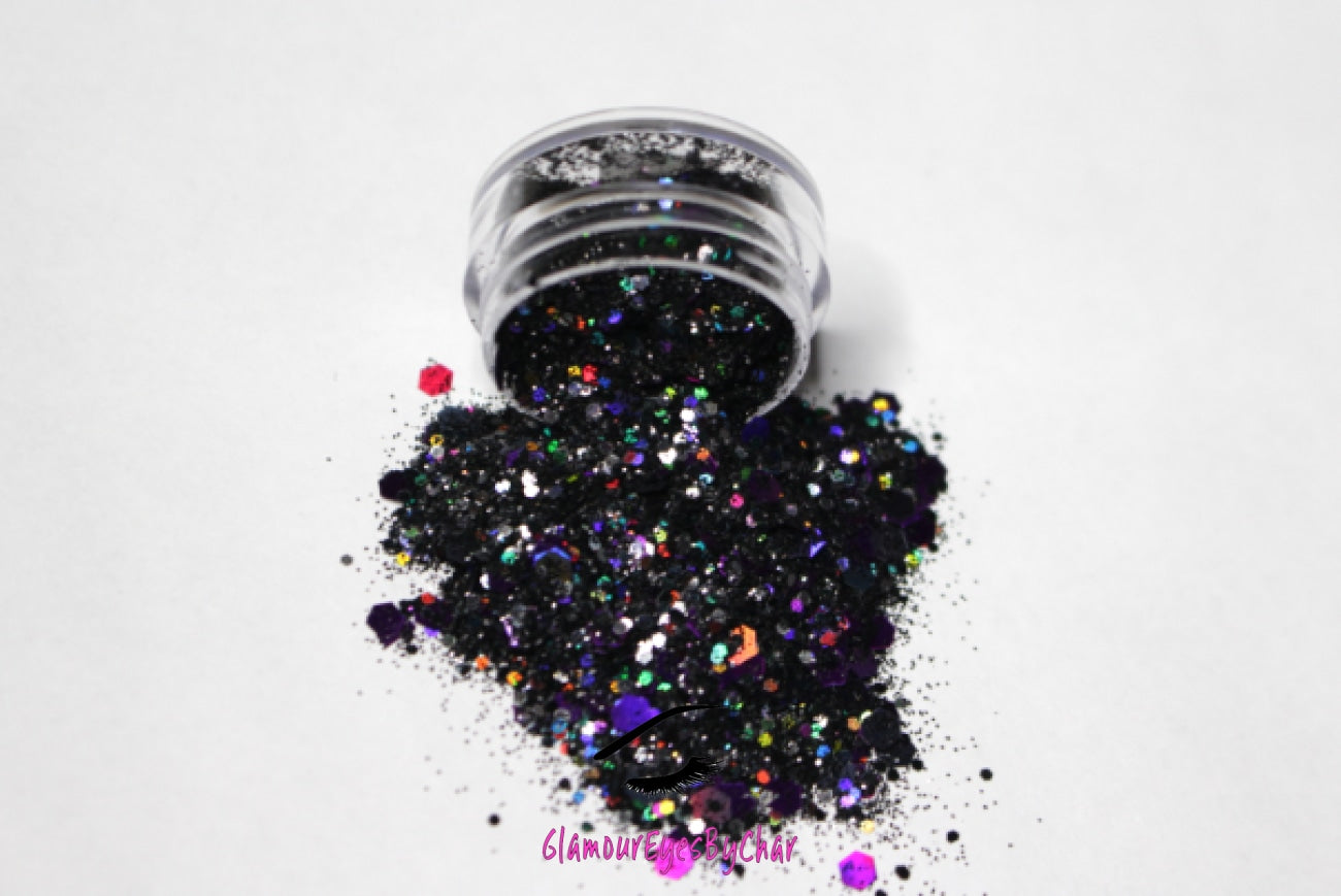 This glitter is called Potion and is part of the super chunky glitter collection.  It consists of black and purple glitter with a holographic sparkle. Potion can be used for your face, body, hair and nails.  Comes in 5g jars only. **Glitter will be discontinued once sold out**   