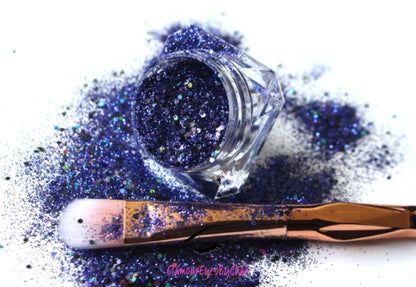 This glitter is called Purple Skies and is part of the chunky glitter collection. It consists of royal purple and a hint of navy glitter with a holographic sparkle.  It’s perfect to create a sexy purple smokey eye look. Purple Skies can be used for your face, body, hair and nails. Comes in 5g jars only.