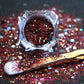 This glitter is called Raptors and is part of the super chunky glitter collection. It consists of ruby red, black, silver, and a touch of gold glitter with a holographic sparkle. If you’re a Toronto Raptors fan, this glitter is perfect for you. Your eyes will stand out in any crowd. Raptors can be used for your face, body, hair and nails. Comes in 5g jars only.