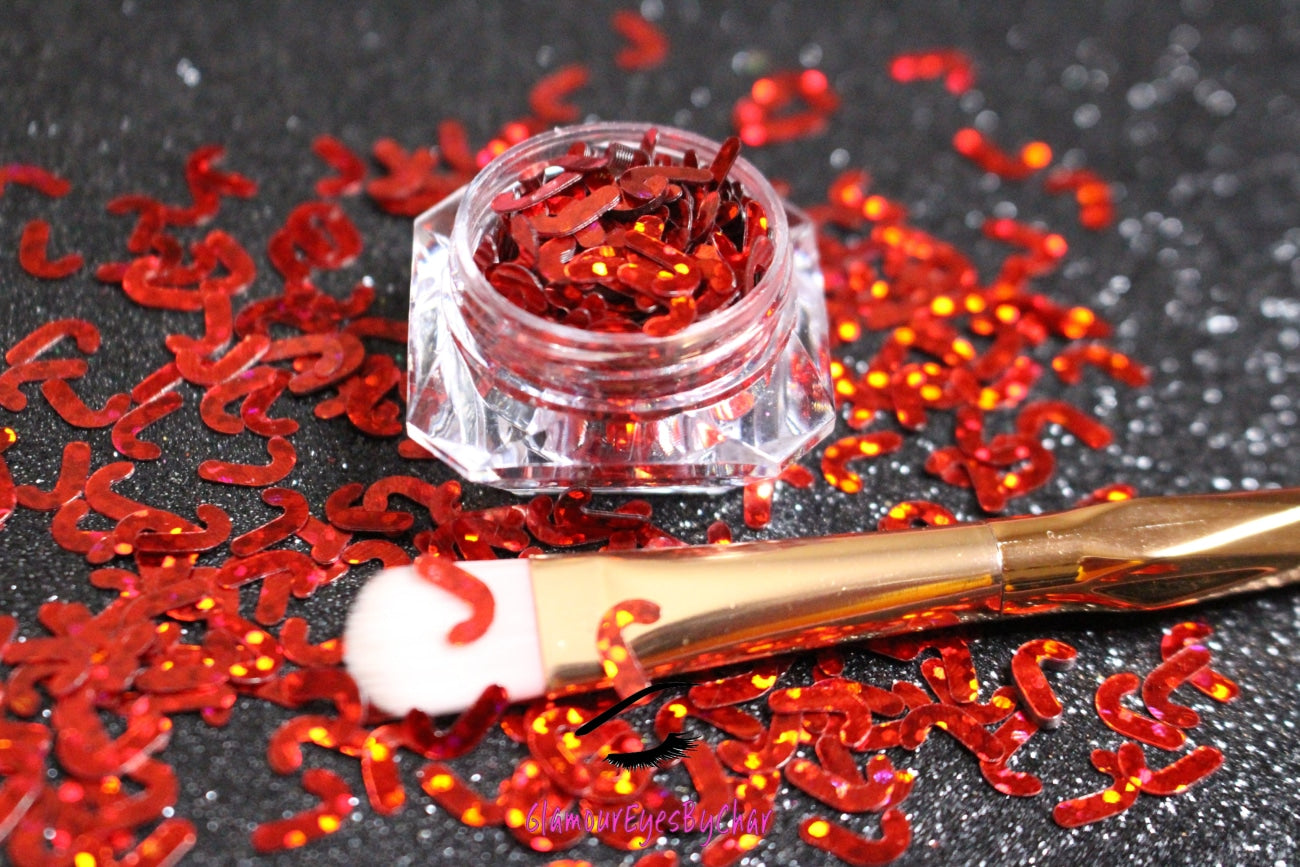 This glitter is called Red Candy Canes and is part of the holiday collection.  It consists of ruby red 7mm candy canes. Red Candy Canes can be used for body and nail art.  Comes in 5g jars only.  