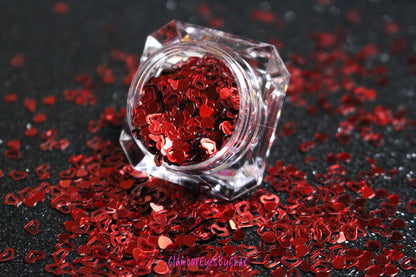 This glitter is called Red Hearts and is part of the shaped glitters collection. It consists of ruby red solid and hollow hearts. Red Hearts can be used for body and nail art or DIY projects. Comes in 5g jars only.