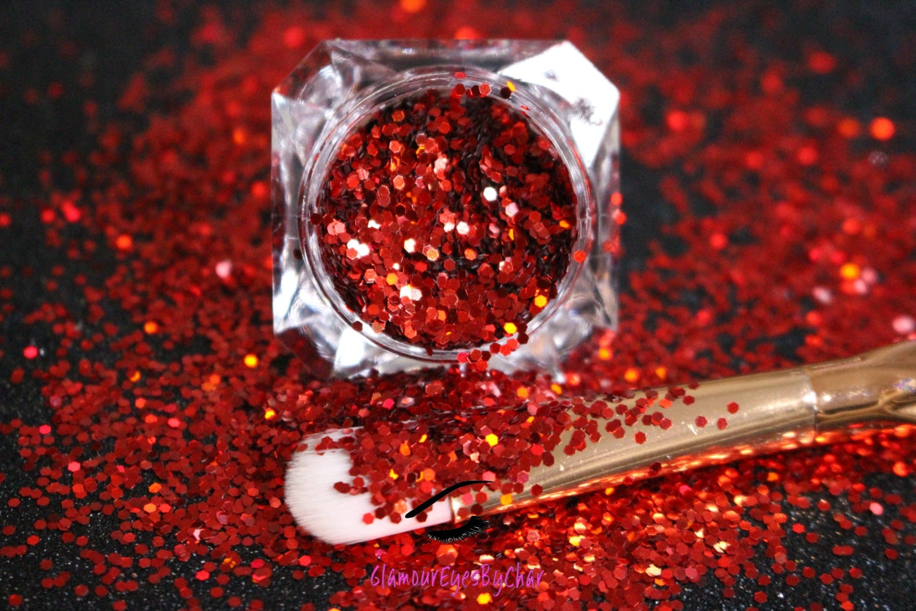 This glitter is called Red Pumps and is part of the simple glitter collection. It consists of ruby red simple glitter. Flake size are larger than fine and extra fine glitter. Red Pumps can be used for your face, body, hair and nails. Comes in 5g jars only.  