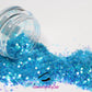 This glitter is called Sea Breeze and is part of the simple glitter collection.  It consists of aqua blue glitter with an iridescent sparkle. Flake size is larger than fine and extra fine glitter. Sea Breeze can be used for your face, body, hair and nails.  Comes in 5g jars only. **Glitter will be discontinued once sold out**