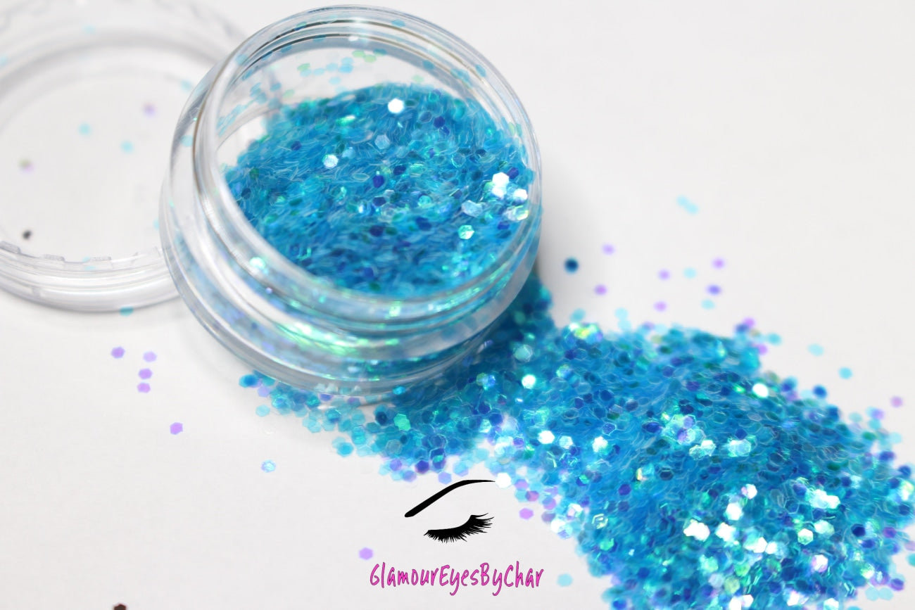 This glitter is called Sea Breeze and is part of the simple glitter collection.  It consists of aqua blue glitter with an iridescent sparkle. Flake size is larger than fine and extra fine glitter. Sea Breeze can be used for your face, body, hair and nails.  Comes in 5g jars only. **Glitter will be discontinued once sold out**