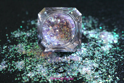 This glitter is called Sweet Lilac and is part of the cellophane glitter flakes collection. It consists of lilac purple iridescent glitter shards with green reflects. Sweet Lilac is perfect for body and nail art, glitter slime, resin art or DIY projects. Comes in 5g jars only.  