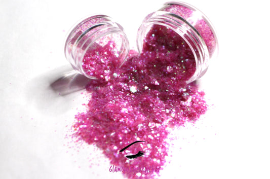 This glitter is called Sweetheart and is part of the super chunky glitter collection. It consists of pink glitter with an iridescent sparkle. Sweetheart can be used for your face, body, hair and nails. Comes in 5g and 10g jars. **Glitter will be discontinued once sold out**