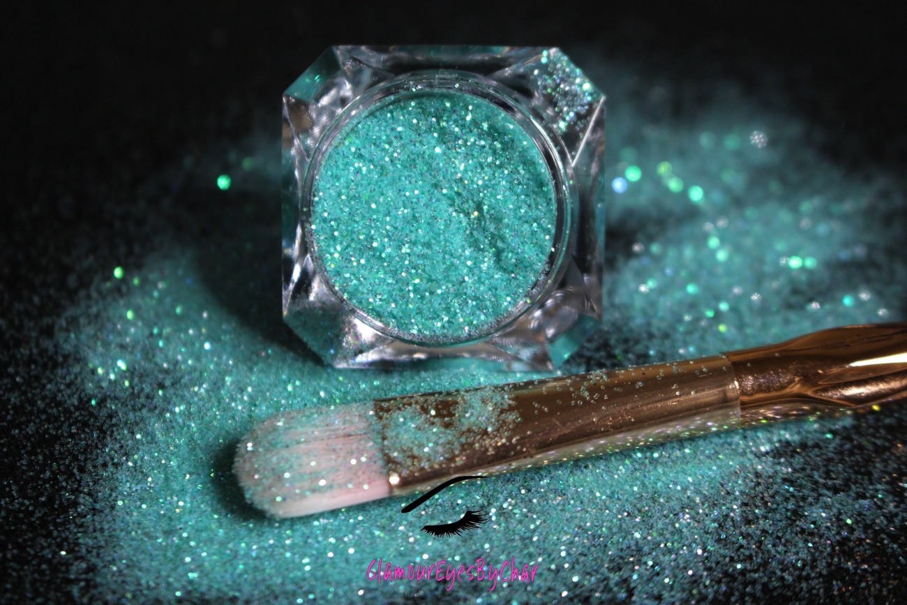 This glitter is called Tiffany and is part of the simple glitter collection. It consists of bright blue iridescent simple glitter that reflects a green sparkle. Tiffany can be used for your face, body, hair and nails.  Comes in 5g only.  