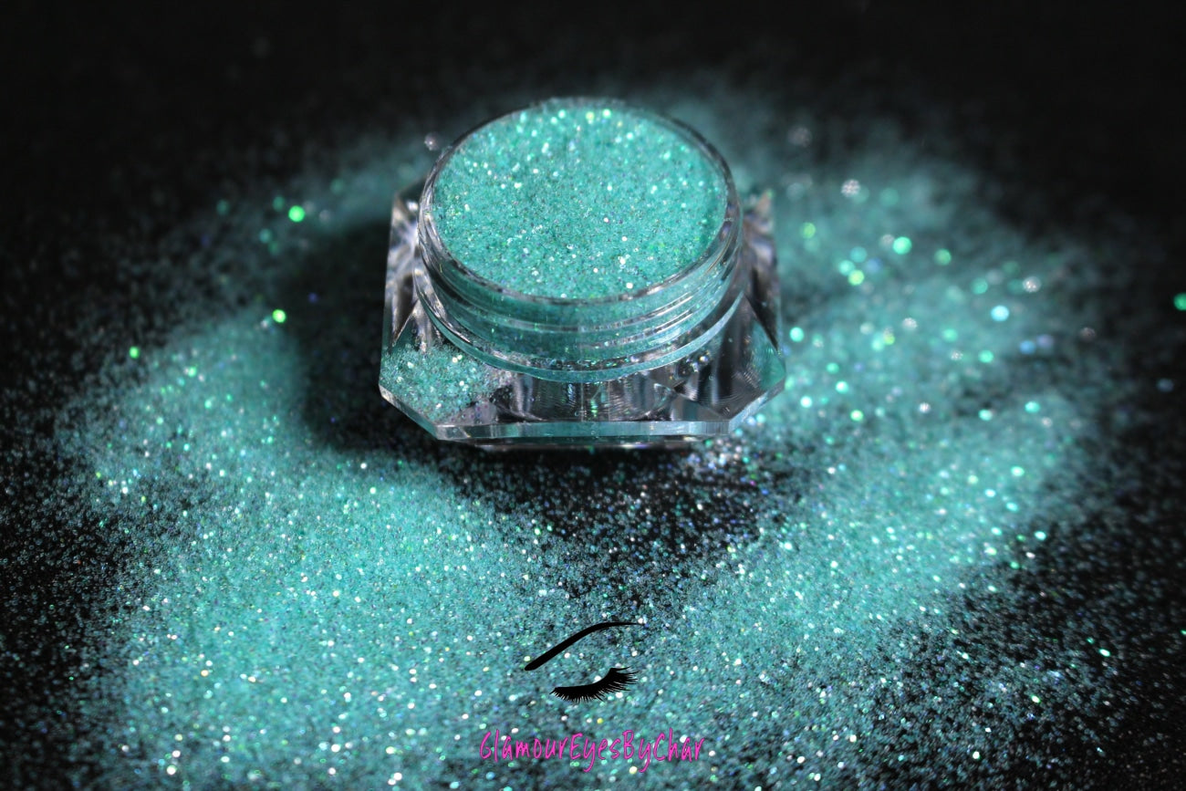 This glitter is called Tiffany and is part of the simple glitter collection. It consists of bright blue iridescent simple glitter that reflects a green sparkle. Tiffany can be used for your face, body, hair and nails.  Comes in 5g only.  