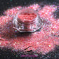 This glitter is called Tropical Sunset and is part of the super chunky glitter collection.  It consists of bright coral and fuchsia glitter with an iridescent sparkle. Tropical Sunset can be used for your face, body, hair and nails.  Comes in 5g jars only. **Glitter will be discontinued once sold out**