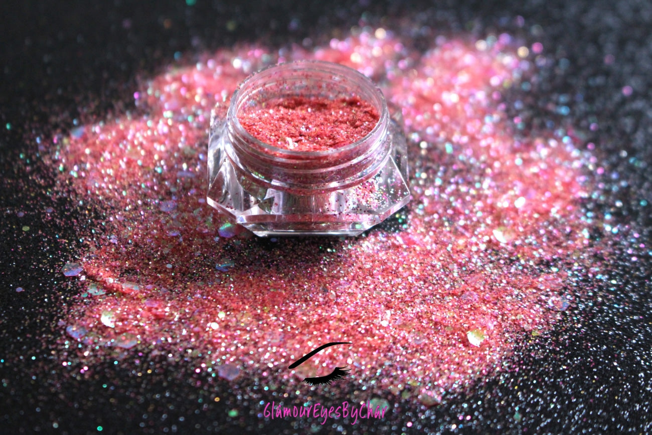 This glitter is called Tropical Sunset and is part of the super chunky glitter collection.  It consists of bright coral and fuchsia glitter with an iridescent sparkle. Tropical Sunset can be used for your face, body, hair and nails.  Comes in 5g jars only. **Glitter will be discontinued once sold out**