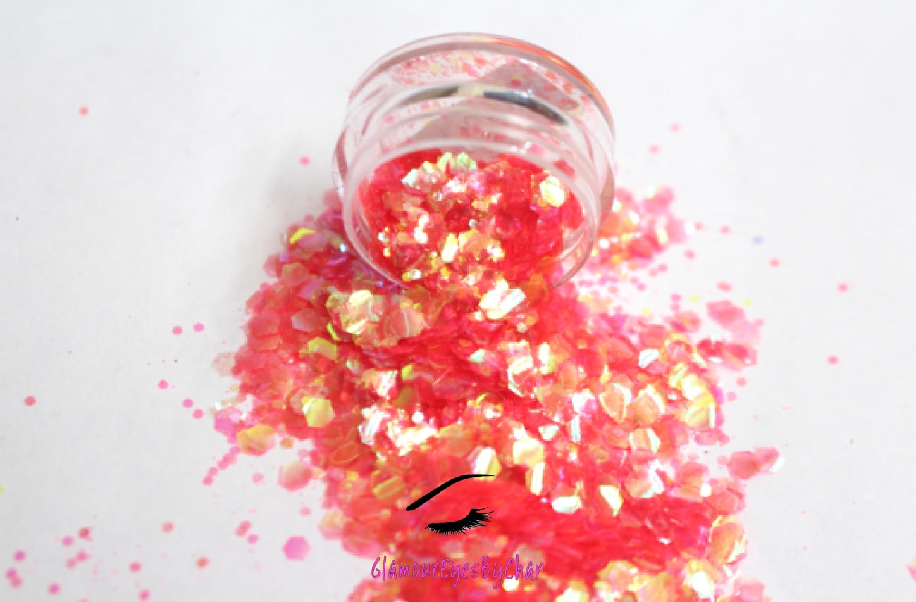 This glitter is called Tropicana and is part of the super chunky glitter collection.  It consists of bright coral glitter with an iridescent sparkle. Tropicana can be used for your face, body, hair and nails.  Comes in 5g jars only.