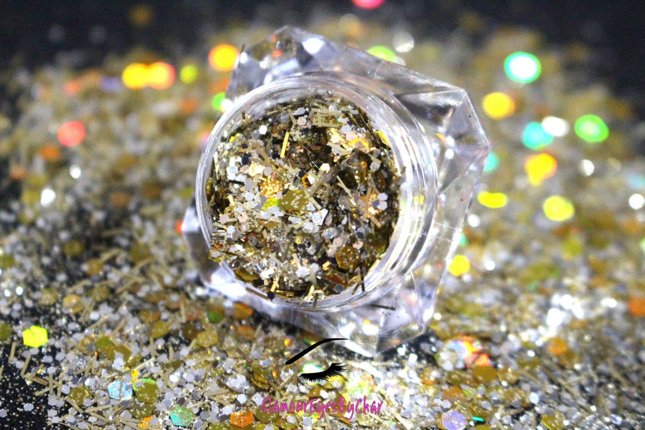 This glitter is called Twilight Zone and is part of the super chunky glitter collection.  It consists gold and silver glitter with a holographic sparkle. Twilight Zone can be used for your face, body, hair and nails.  Comes in 5g jars only. **Glitter will be discontinued once sold out**